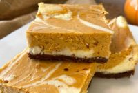 Spiced Pumpkin Swirl Cheesecake Bars