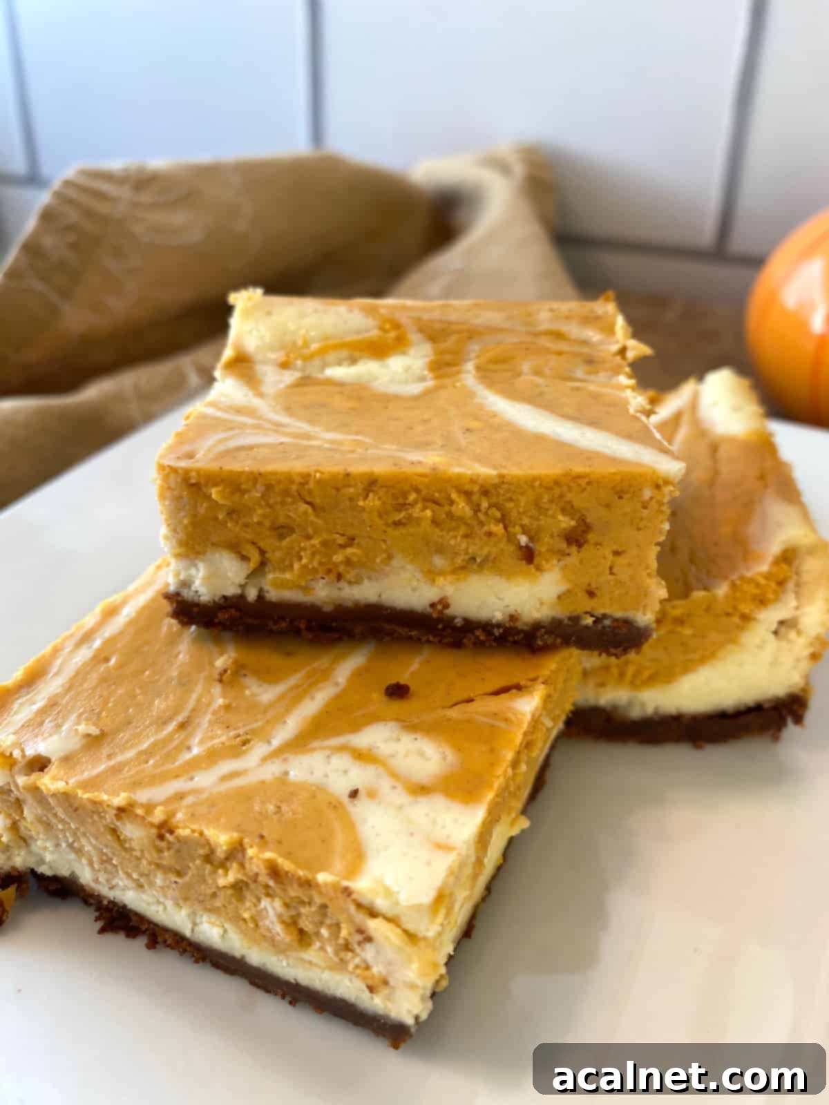 Spiced Pumpkin Swirl Cheesecake Bars 1 featured 4447