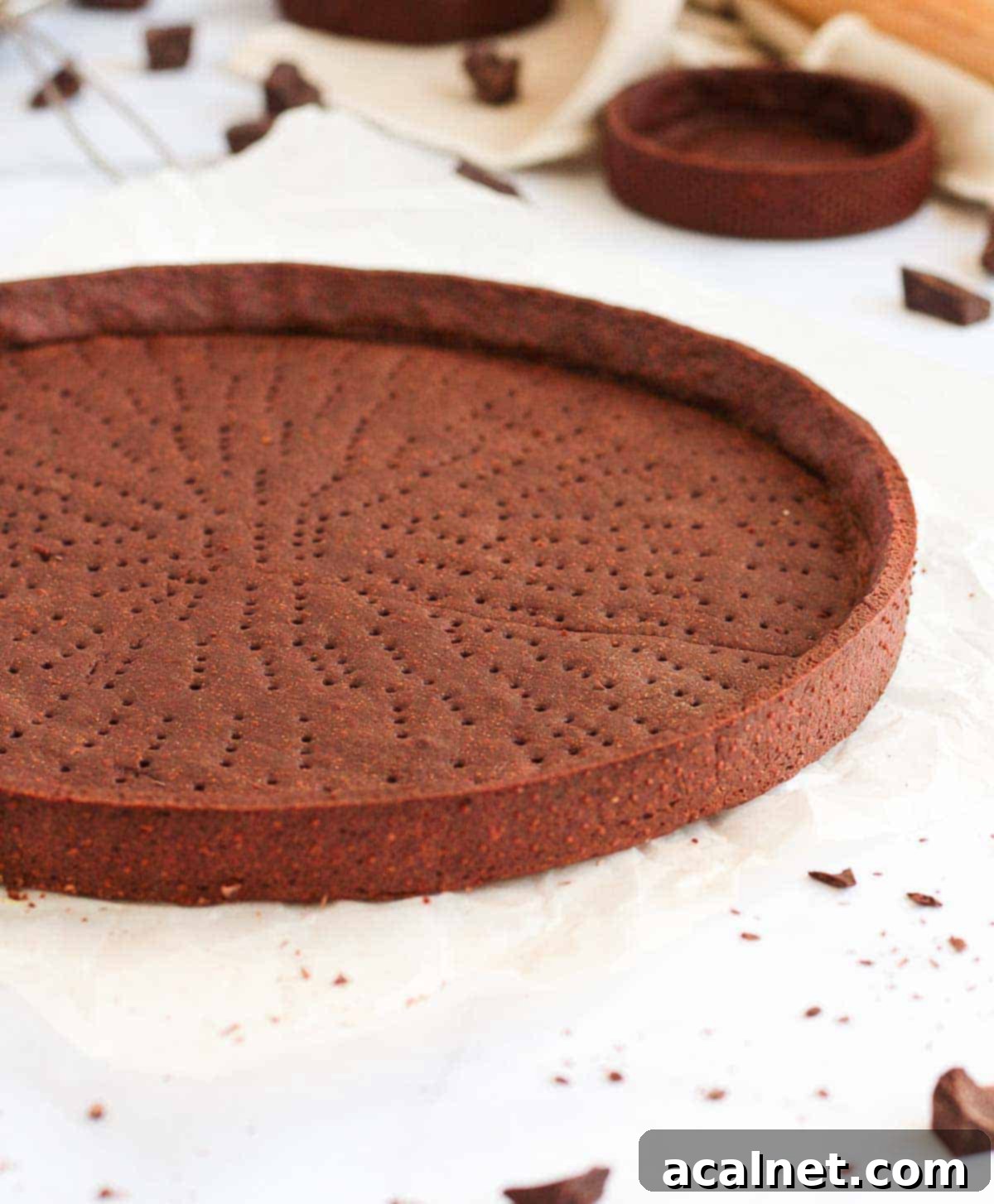 View on the side of the baked crust placed on a white surface.