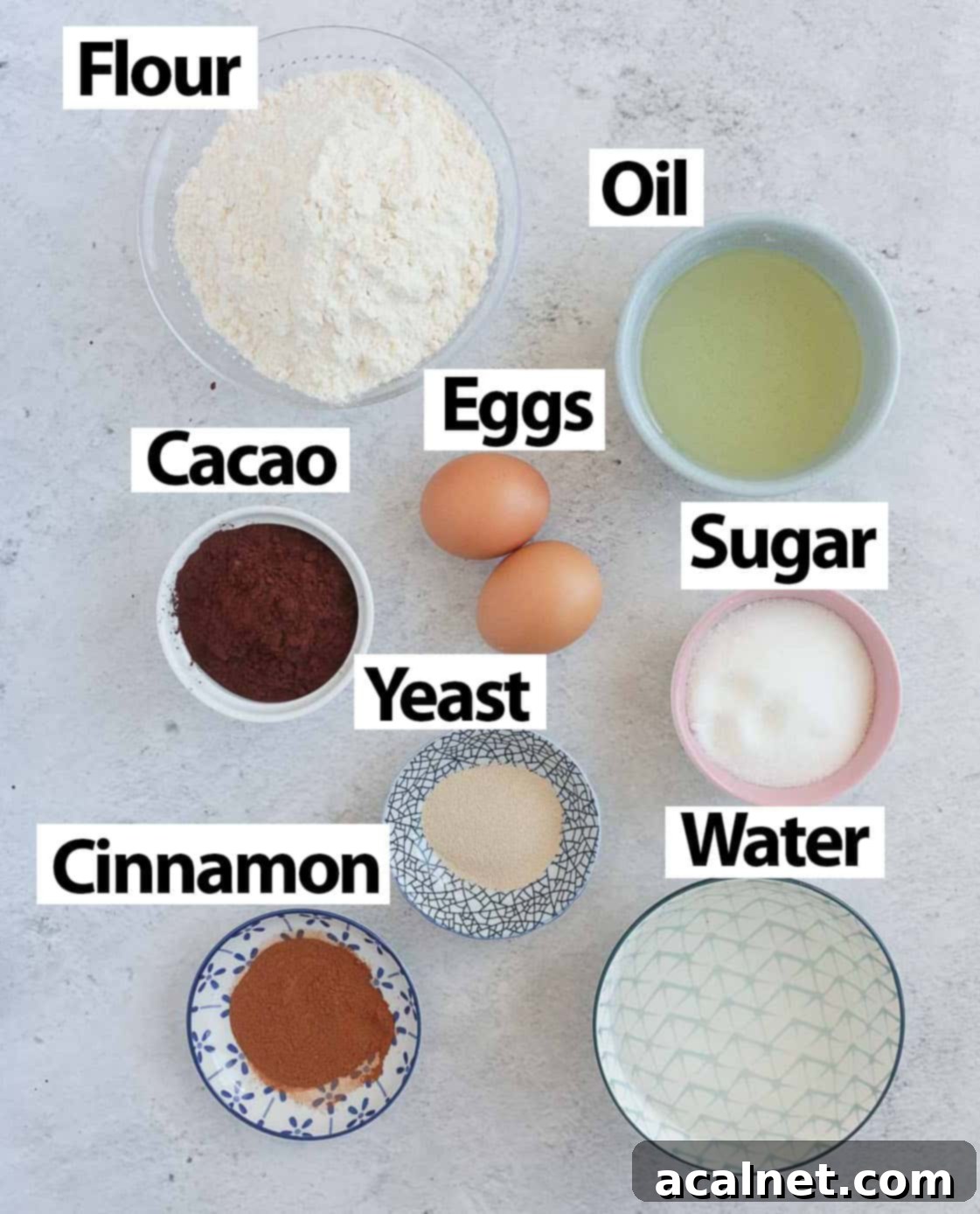 Ingredients placed on a grey surface.