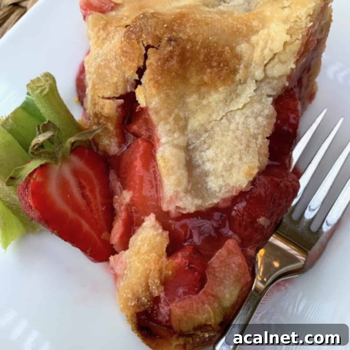 A golden-crusted old-fashioned strawberry rhubarb pie.
