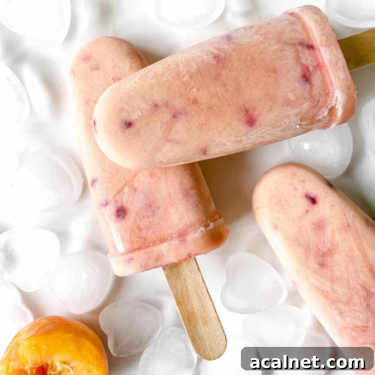 Creamy peaches and cream popsicles with a hint of pink.
