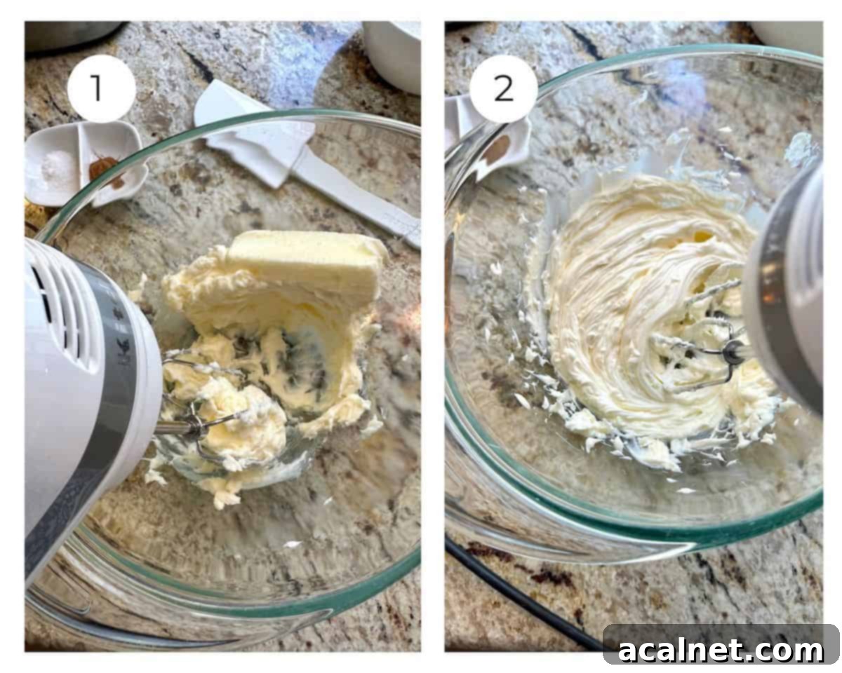 Softened butter in a glass mixing bowl being vigorously whipped by a hand mixer until it becomes light and fluffy.