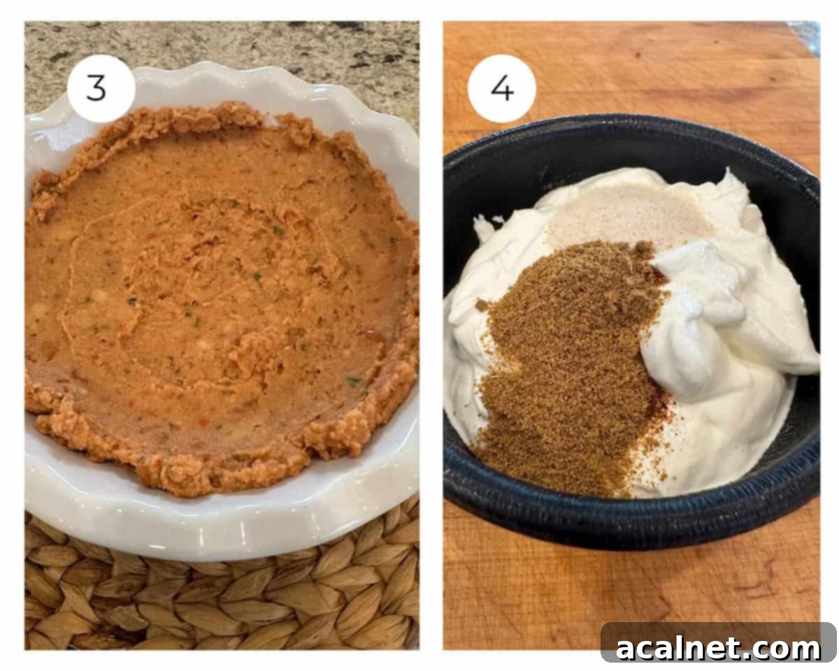 Refried beans spread in a dish, next to a bowl of sour cream mixed with spices.