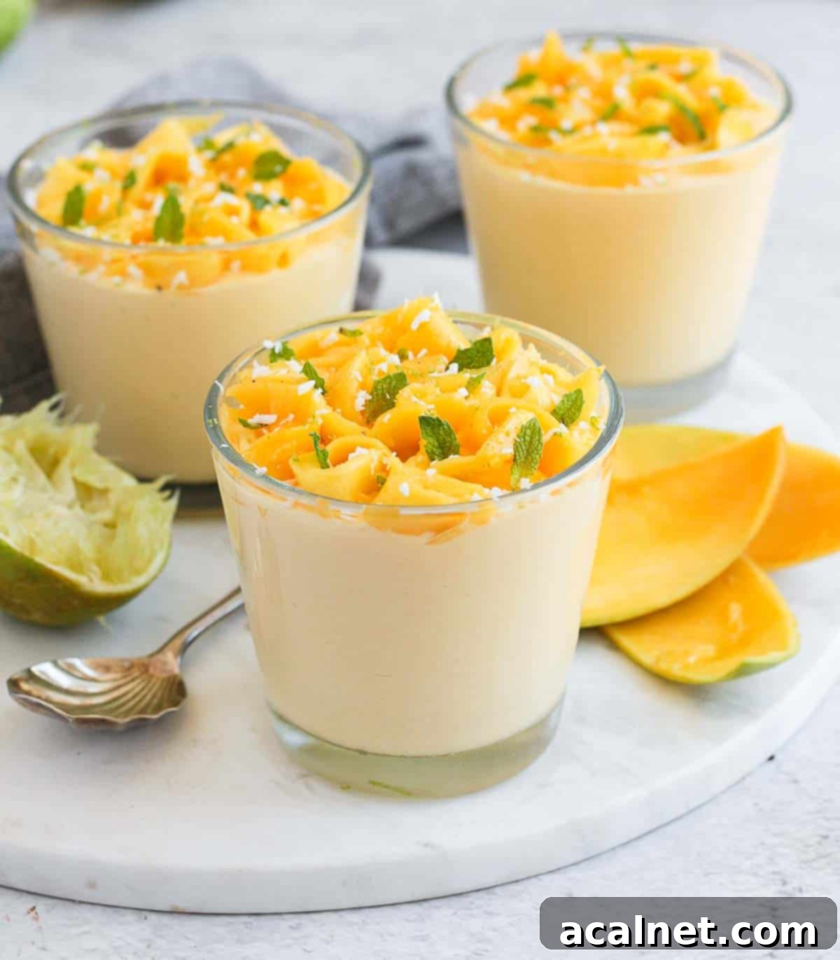 Three cups on a grey marble board.