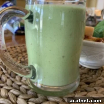 Smoothie in a large glass cup.