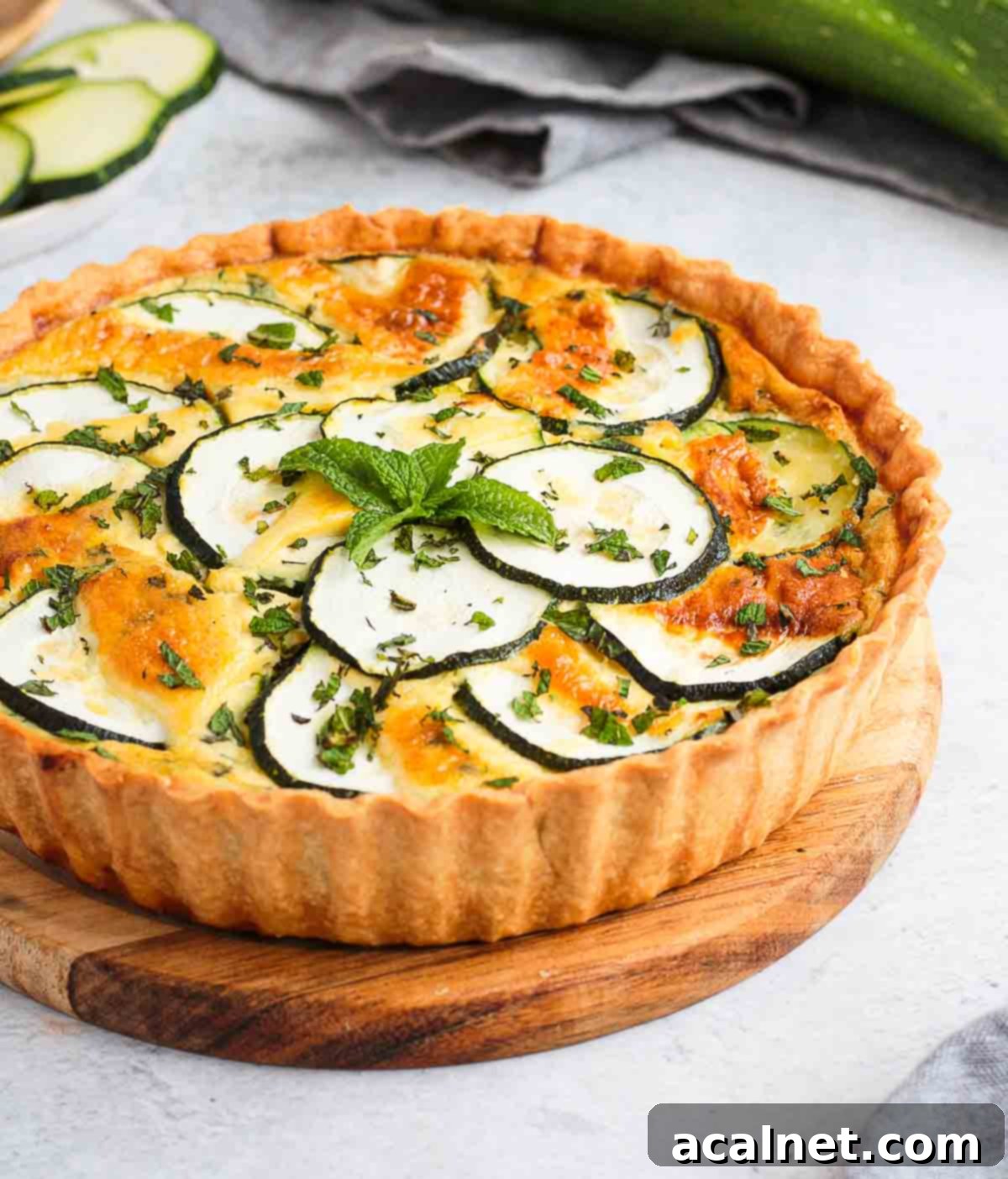 A close-up view of the baked Zucchini Quiche filling, showing the textures of zucchini and feta.