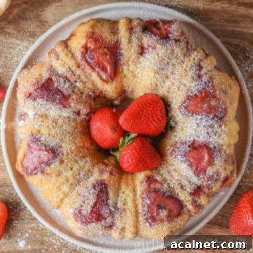 Beautifully baked Strawberry Bundt Cake, showcasing its elegant shape and fresh strawberry inclusions.