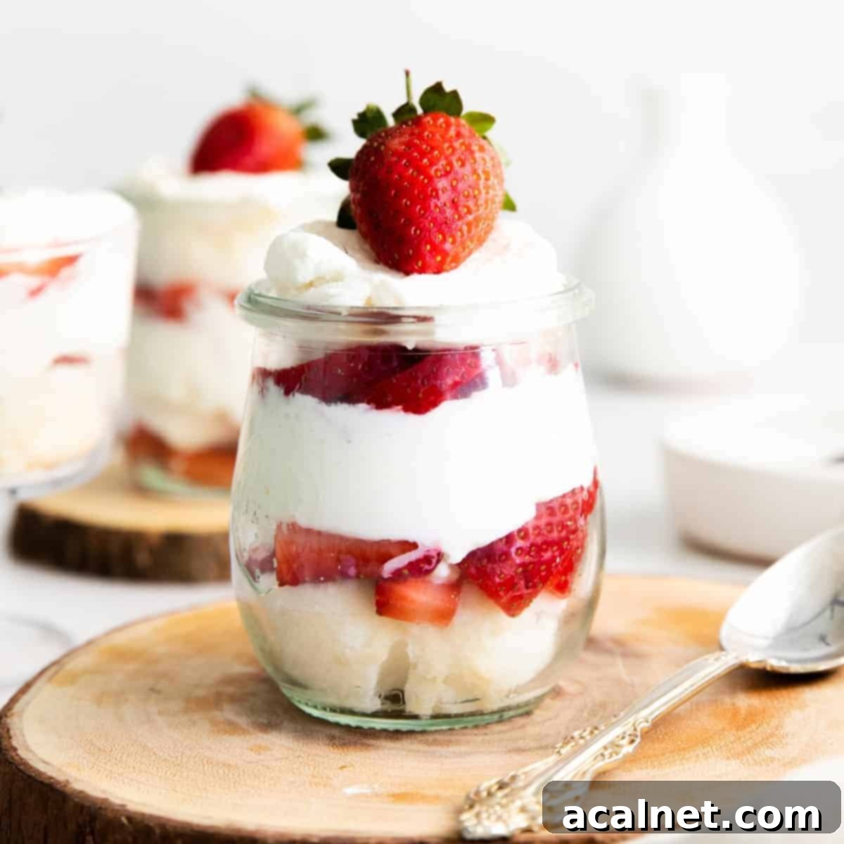Layers of delicious Mini Strawberry Shortcake Trifles in glasses, ready to serve.
