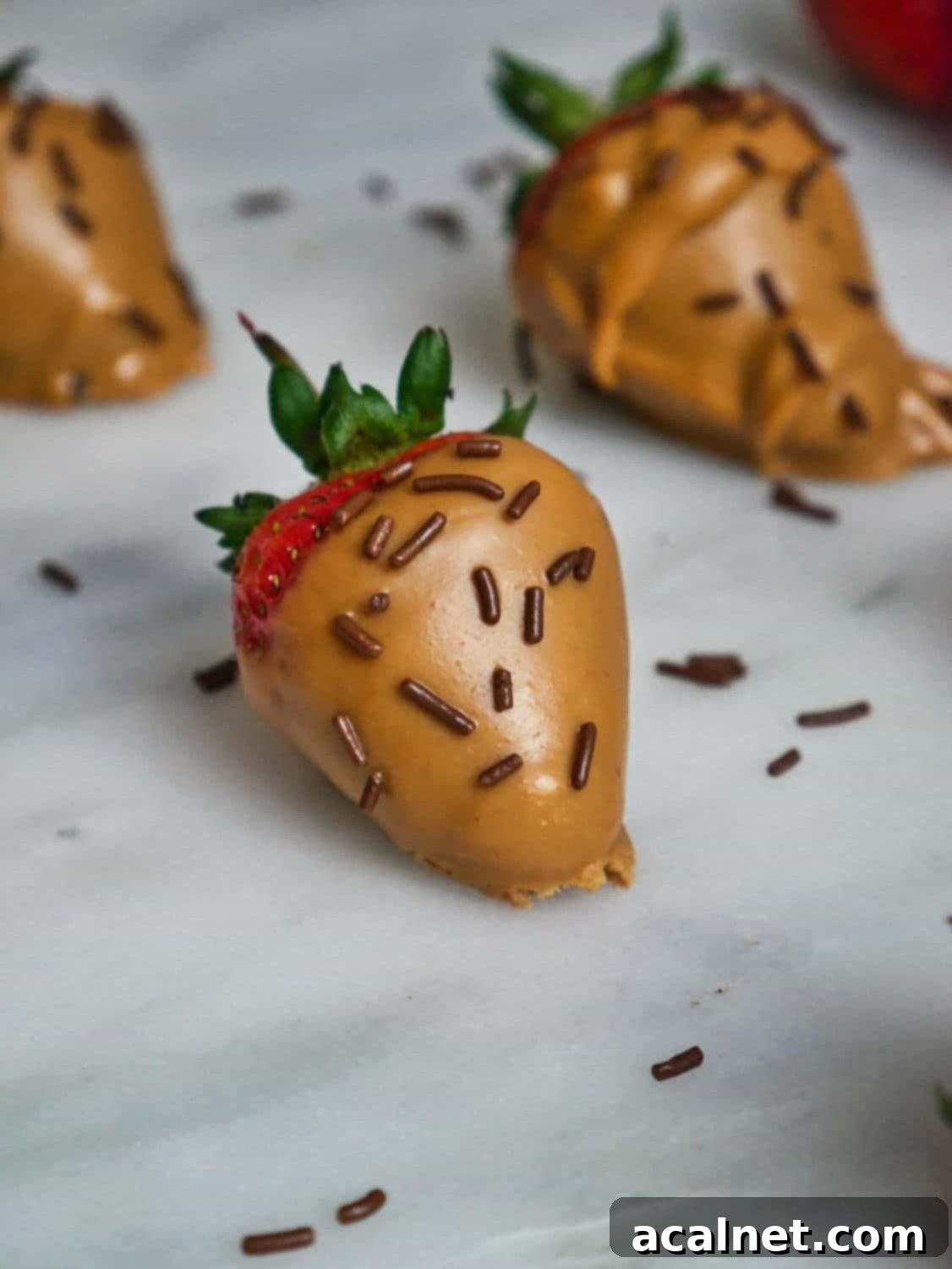 Strawberry Cheesecake Cookies, featuring a creamy filling between two shortbread layers.