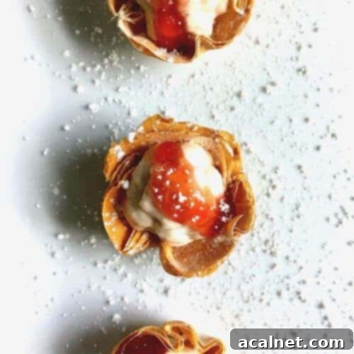 Quick and easy Strawberry Phyllo Cups with a creamy cheese filling, topped with fresh berries.