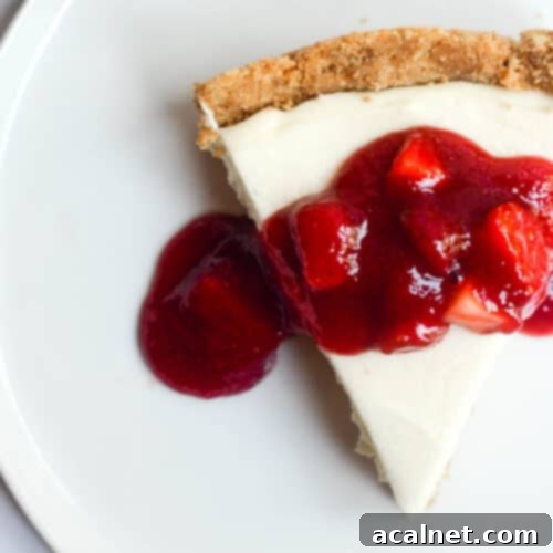 Individual Mini Strawberry Cheesecakes with fresh berry compote topping.