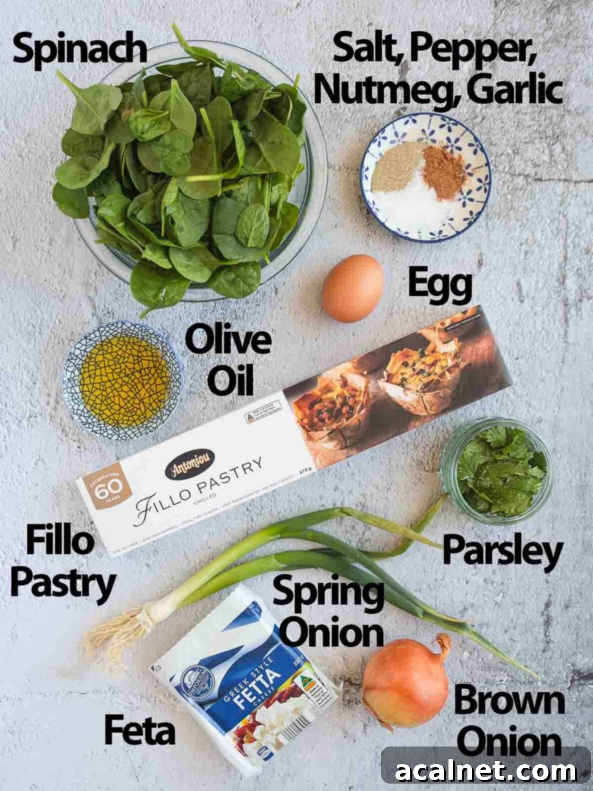 Crispy Golden Spanakopita Treats 3 Ingredients placed on a grey surface.