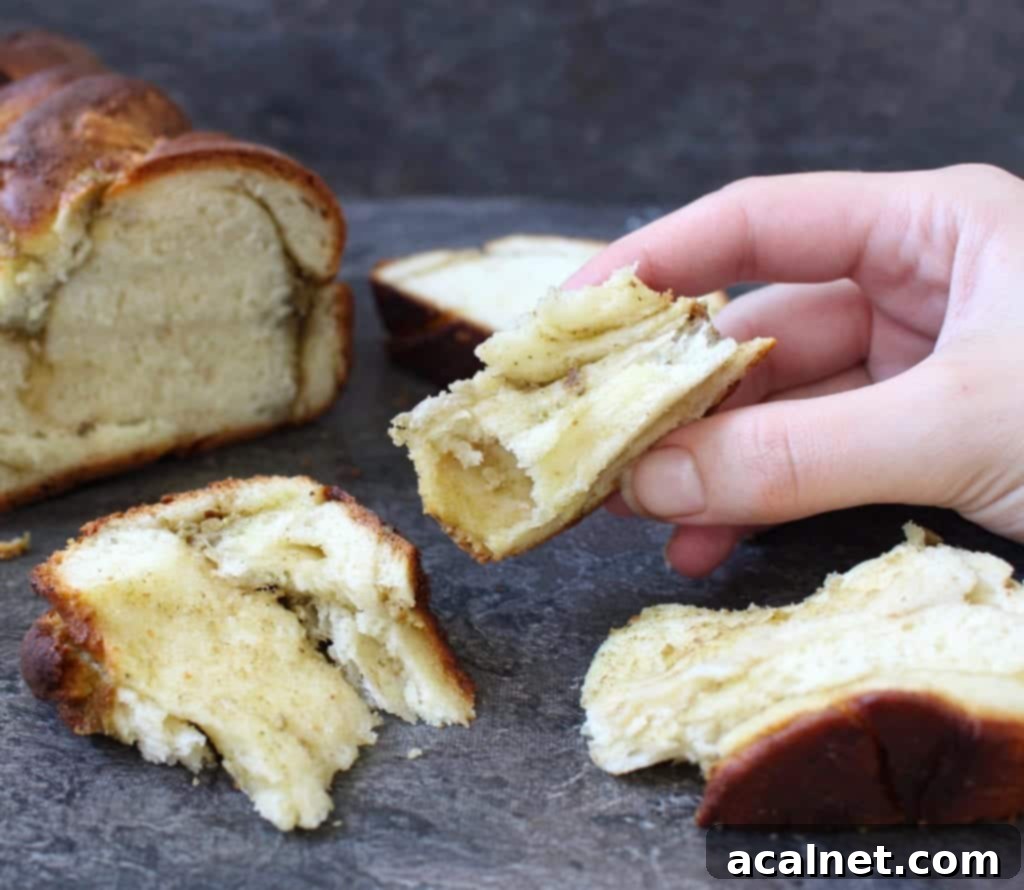 A top-down view of a freshly baked Pesto Mozzarella Babka Bread, golden and inviting, ready to be sliced.