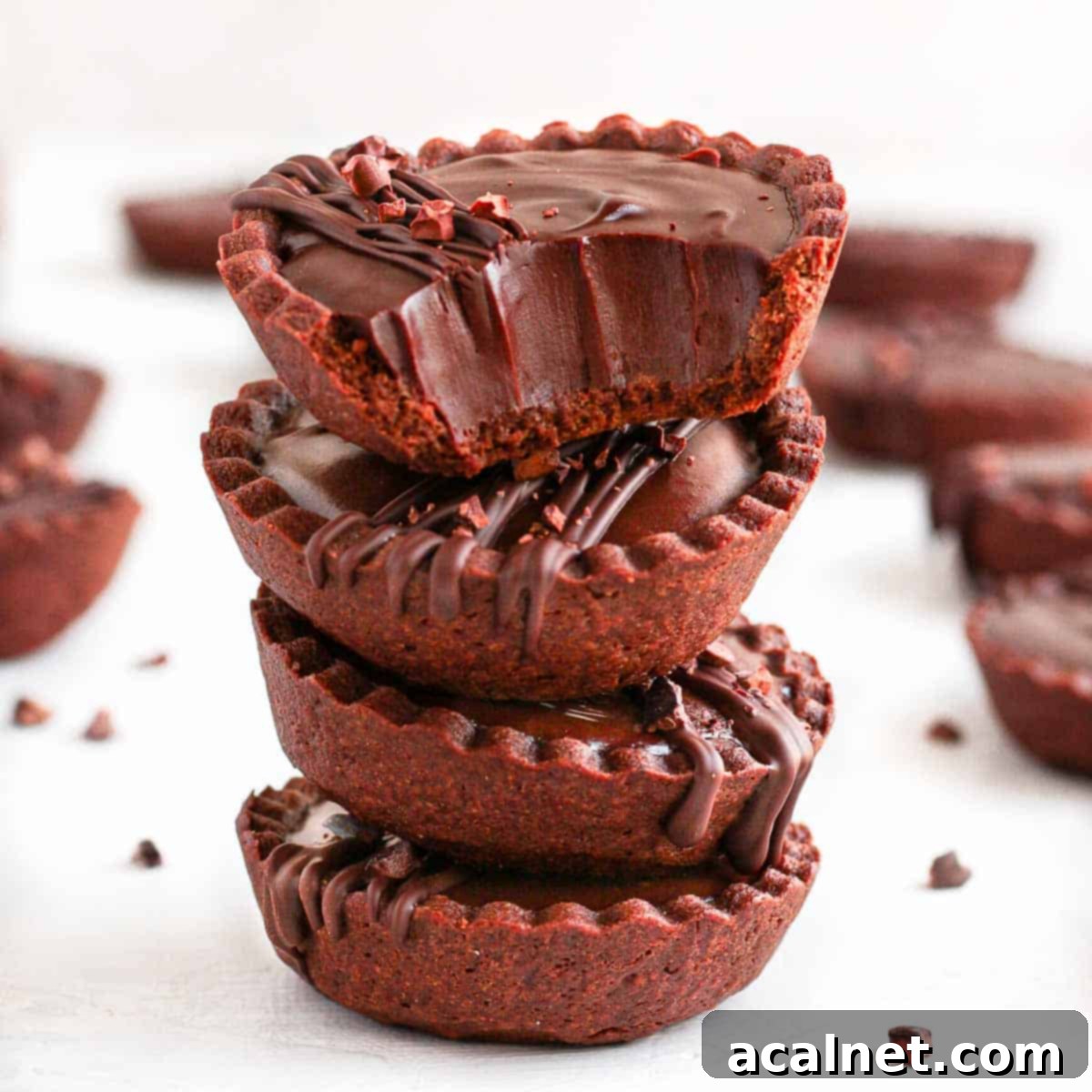 Stack of 4 chocolate tarts.