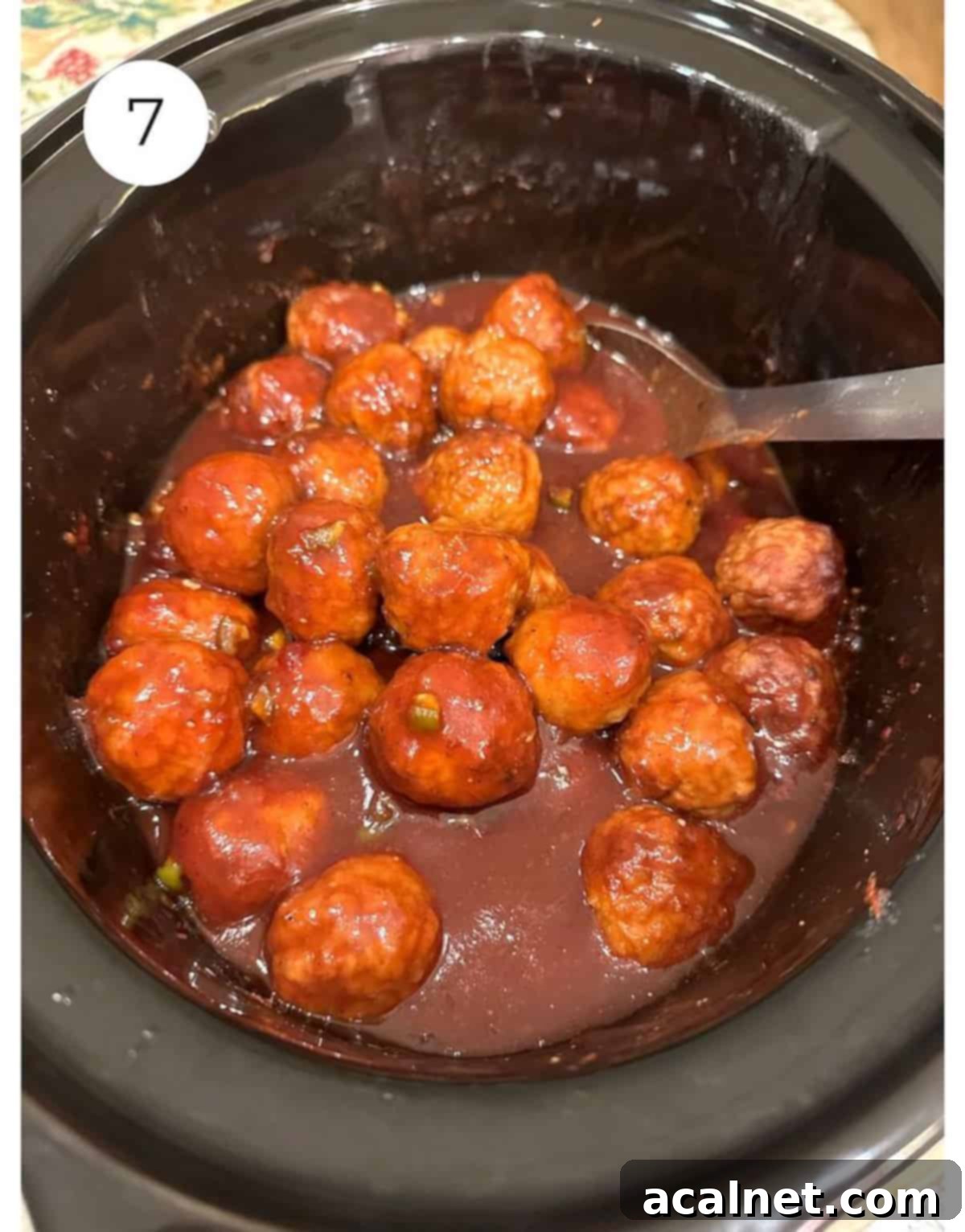 Sweet Heat Cranberry Jalapeño Meatballs 7 Frozen meatballs coated in cranberry jalapeno sauce in a slow cooker.