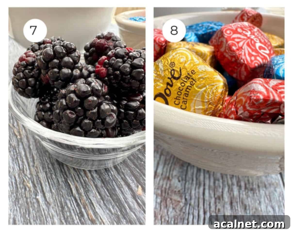 A small bowl of blackberries and one of wrapped chocolates.