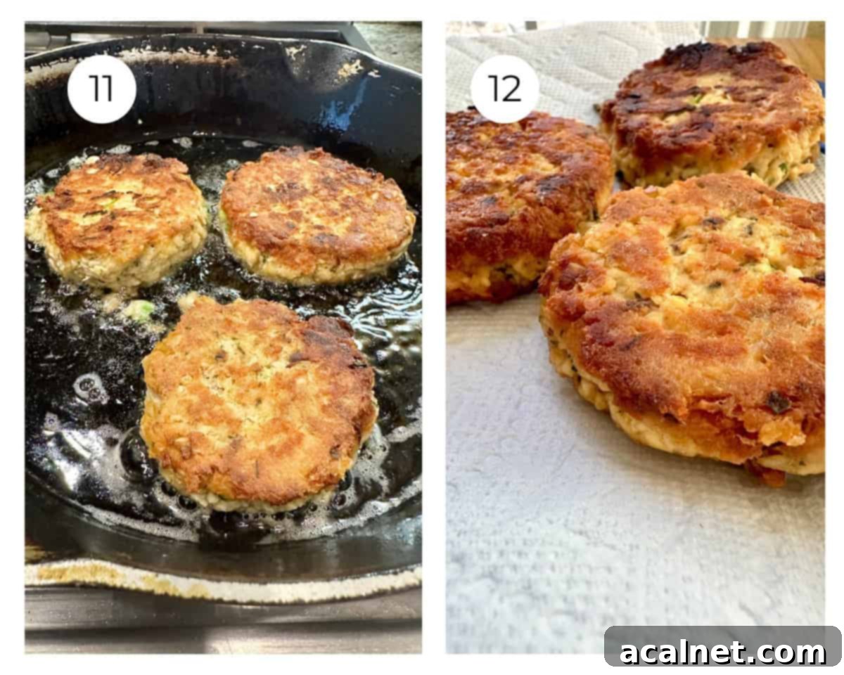 Salmon patties in oil in a skillet and on a paper towel.