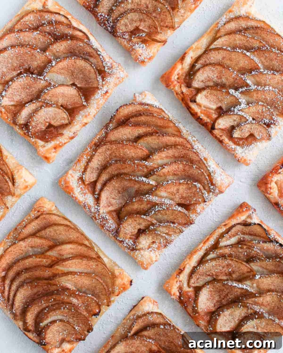 Tartlets seen from above on a white surface.