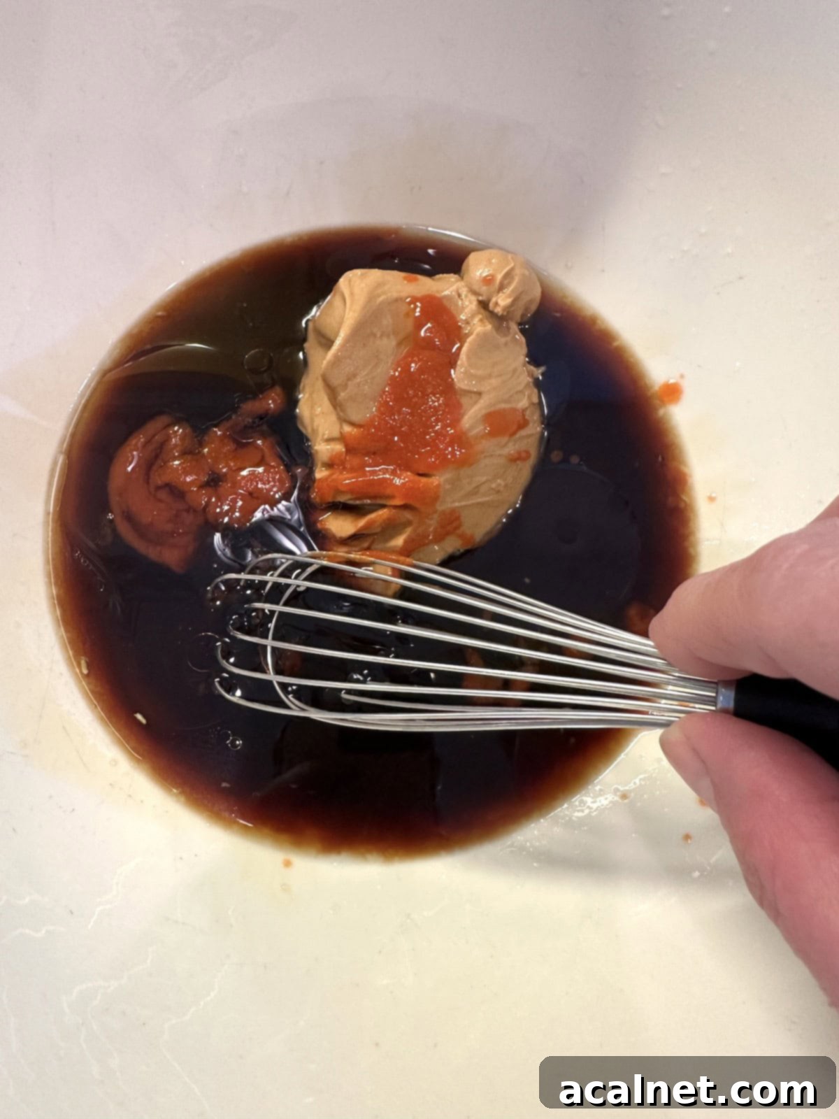 Peanut spicy noodle sauce ingredients in a bowl, not blended.