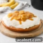 Delicious Banana Bread Cake with Cream Cheese Frosting and Caramelized Bananas, a perfect dessert baked in a Remoska.