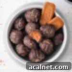Truffles from above in a grey bowl with biscoff cookies.