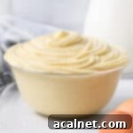 Diplomat Cream in a glass bowl surrounded by ingredients.