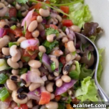 A close-up shot revealing the fresh, colorful ingredients of a Spicy Black-Eyed Pea Salad.