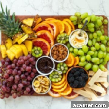 A beautifully arranged Fruit Charcuterie Board, featuring an assortment of fresh, colorful fruits.