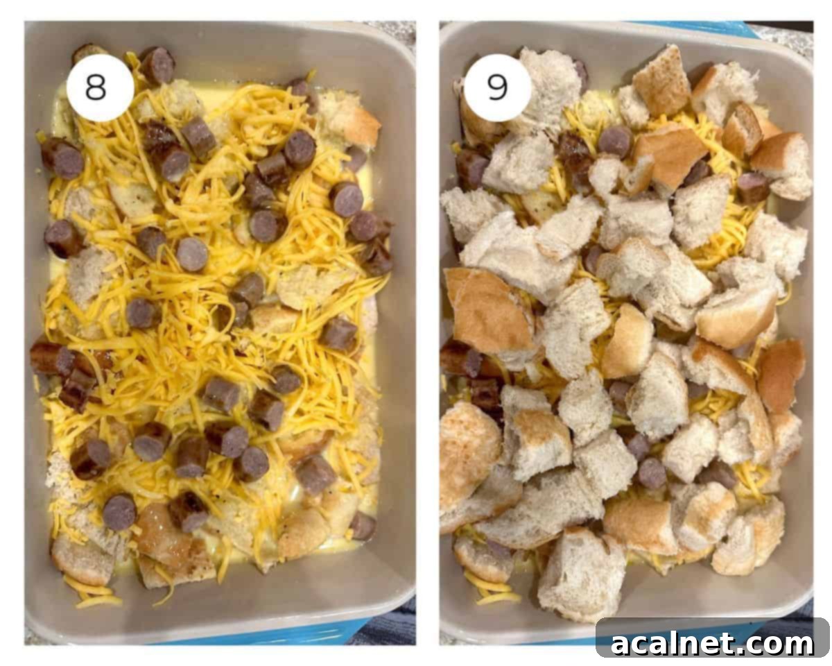 Cheesy Sausage and Egg Bake 8 A baking dish with all layers of diced bread, shredded cheese, and cooked diced sausage, with half of the egg mixture already poured, illustrating the layering process.