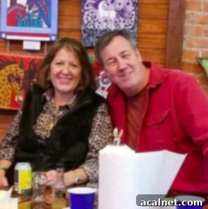 MeMe and Jack Owen sitting at a table, smiling.