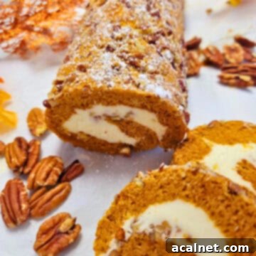 A beautifully sliced pumpkin roll, revealing its creamy filling and garnished with chopped pecans.