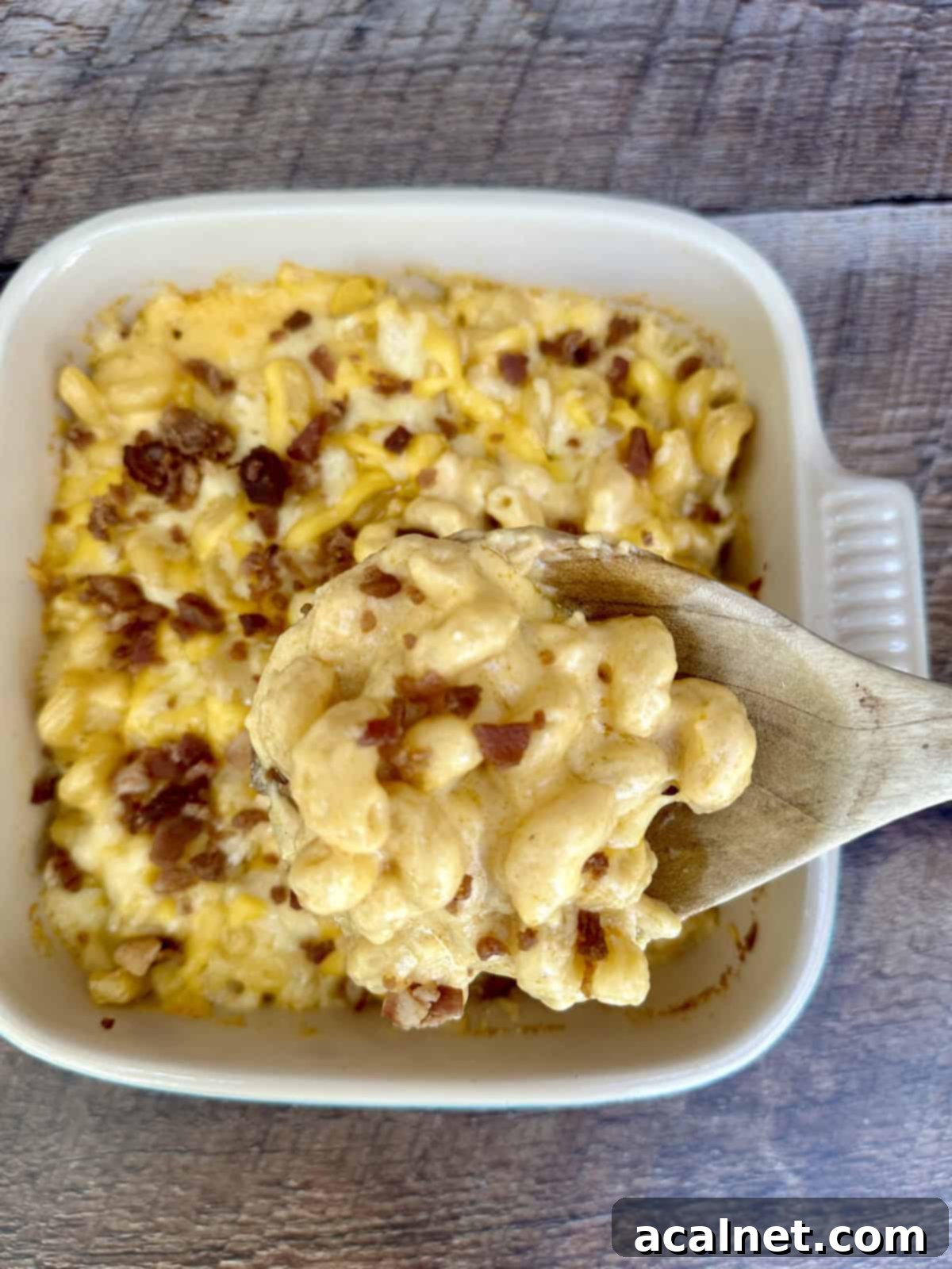 A dish of mac and cheese with bacon on top.