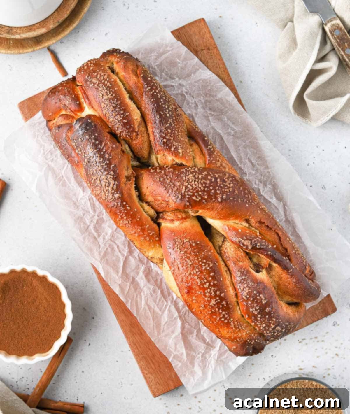 Cinnamon sweet bread seen from above on a wooden board, ready to be served.