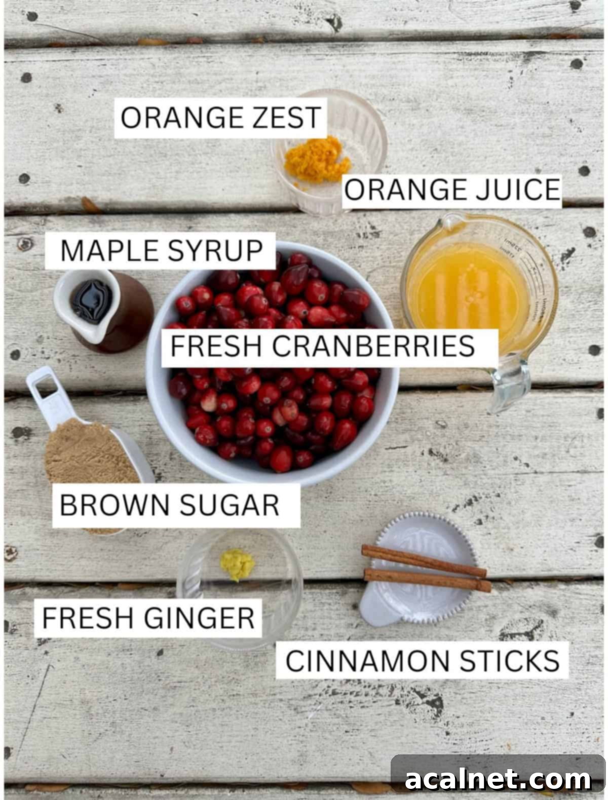 Ingredients for Orange Cranberry Sauce in small containers on a table.