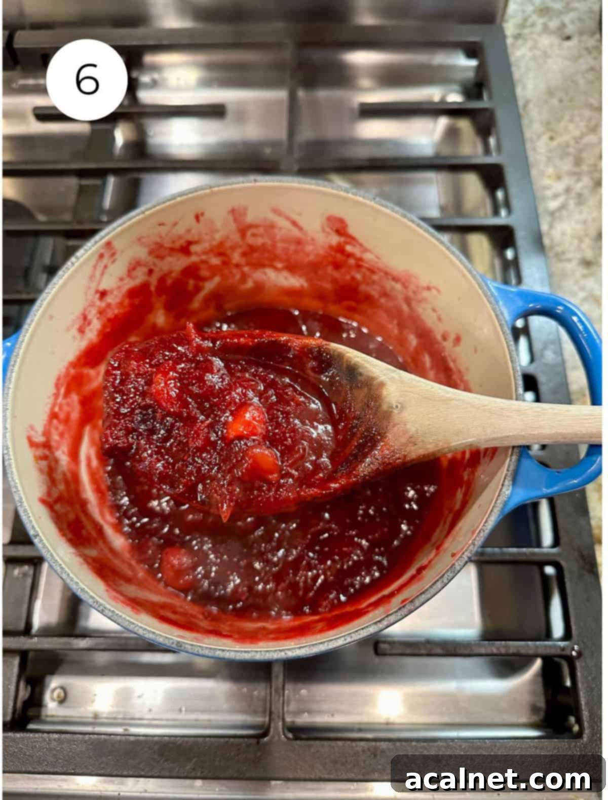 Cranberry sauce in a pan on the stove.