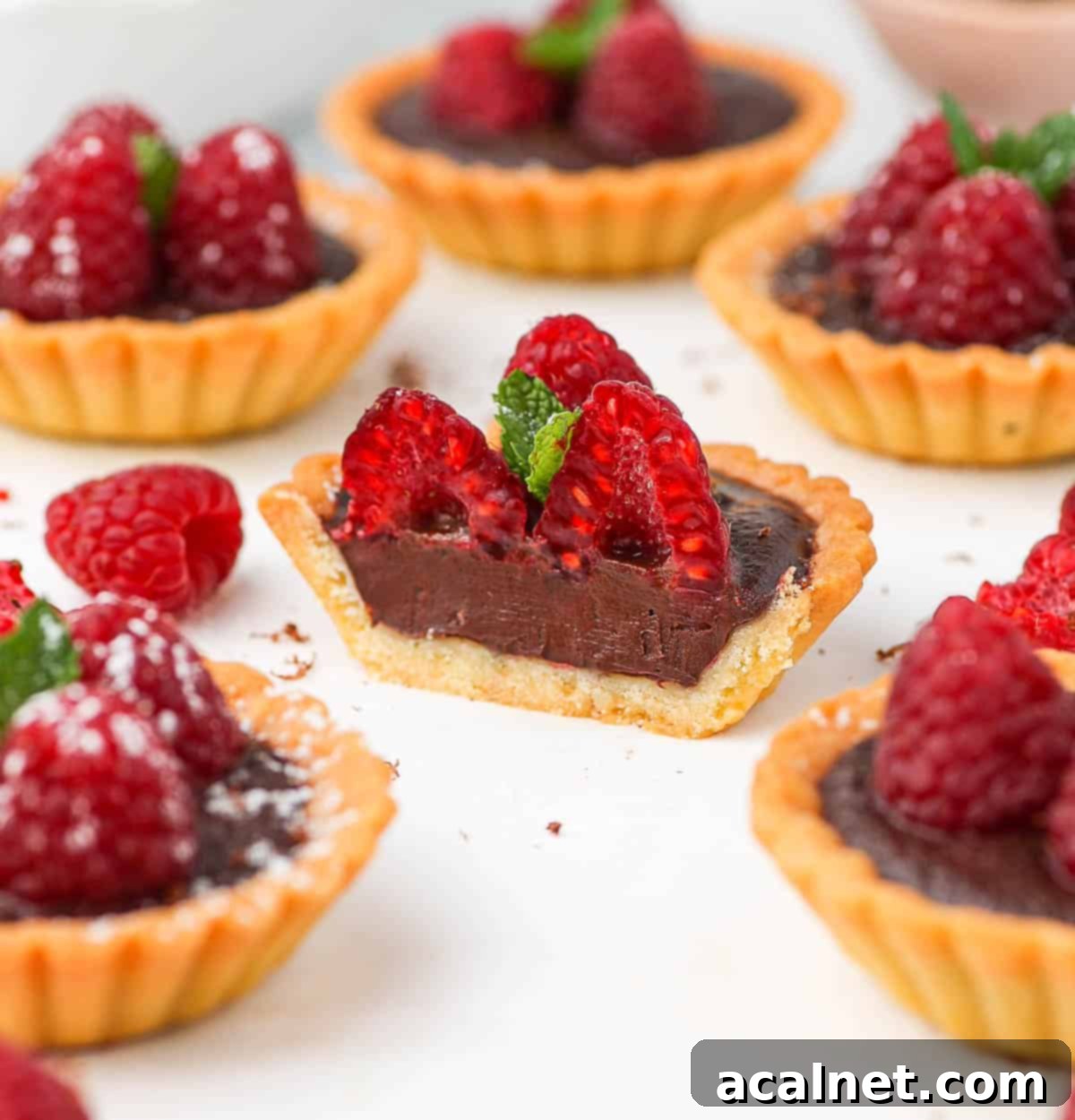 Half a tartlet around more mini tarts.