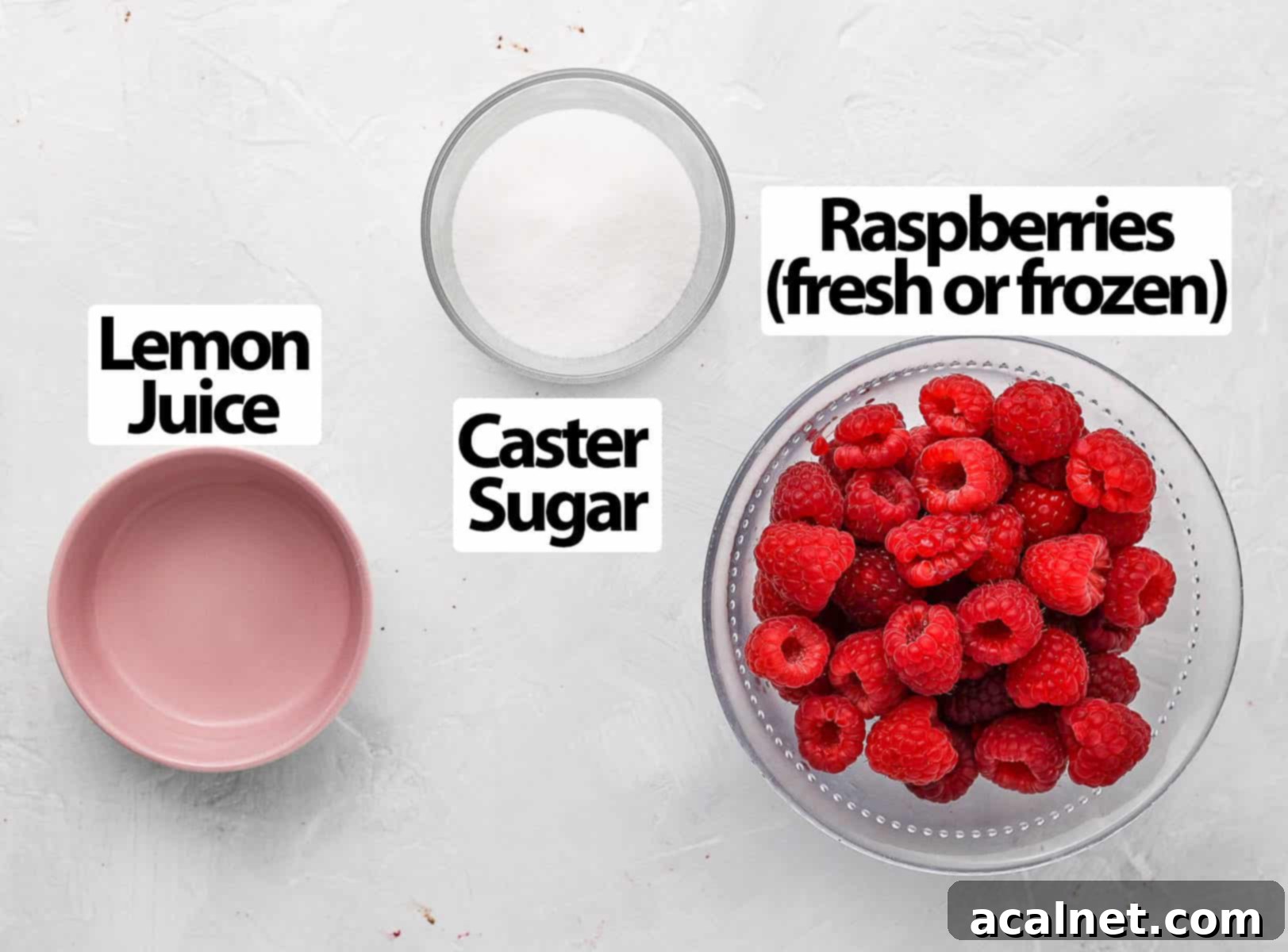 Easy 3 Ingredient Raspberry Compote 3 Three core ingredients for raspberry compote: raspberries, sugar, and lemon juice, arranged on a white surface.