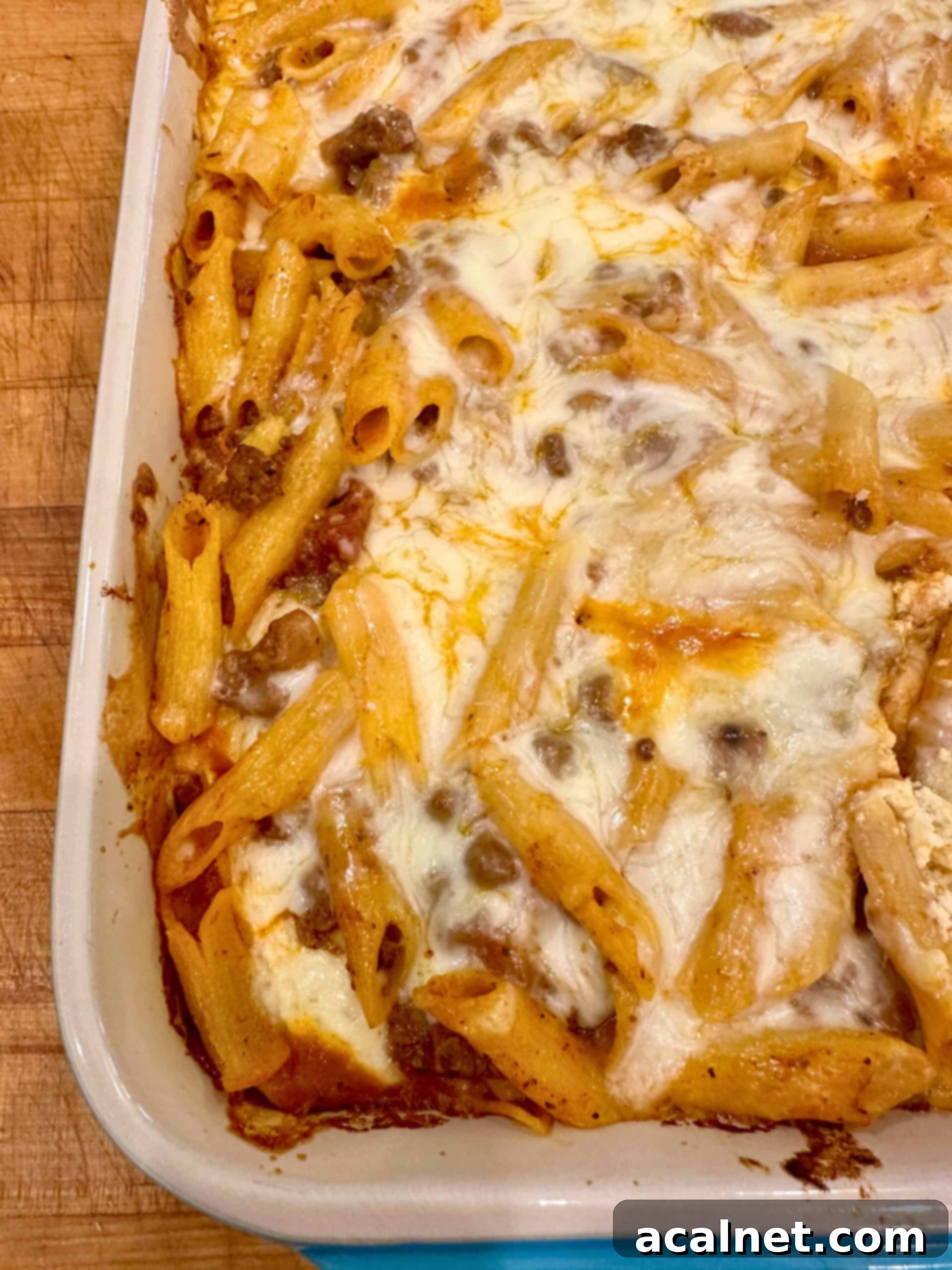 No-layer ricotta and ground beef lasagna in a casserole dish, fresh out of the oven.