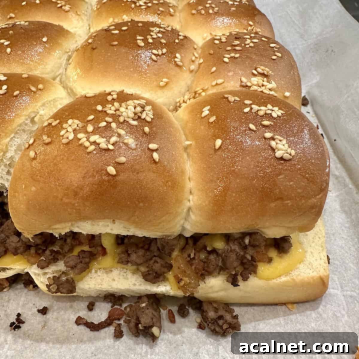 A pan of baked cheeseburger sliders.