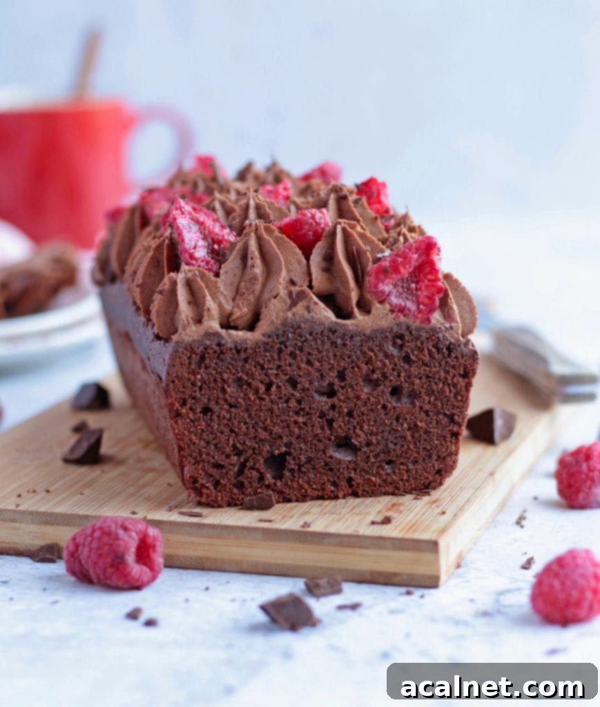 Crumb shot of a moist Chocolate Loaf over a wooden board - delicious chocolate cake
