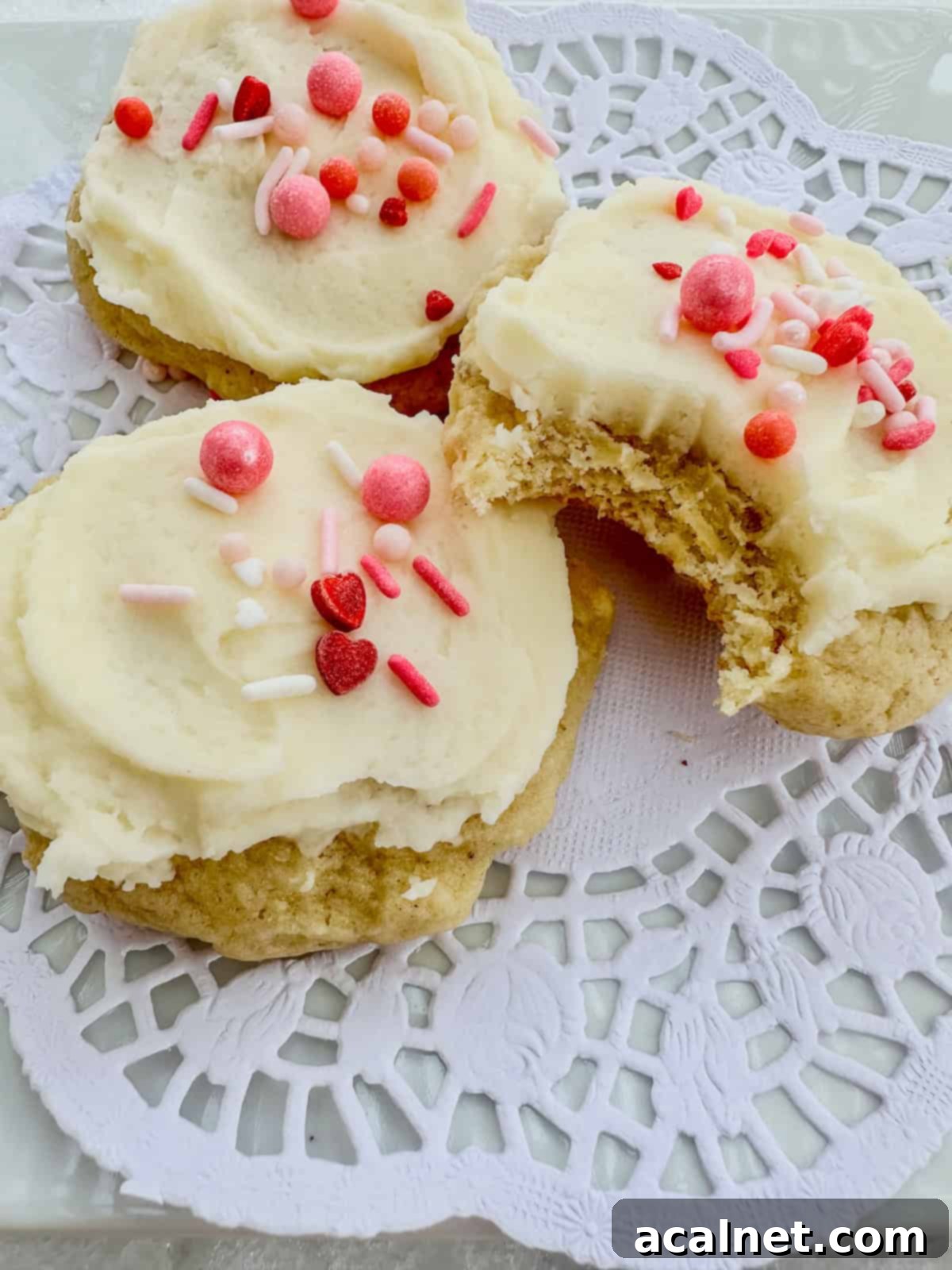 Sour cream cookies and one with a bite mark.