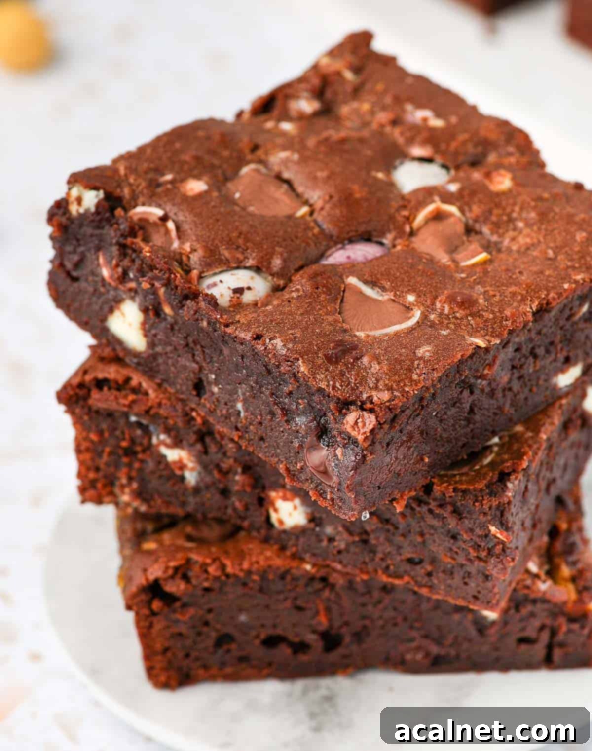 Close up on a stack of 3 brownies slices.
