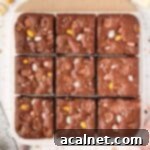 Easter brownies on a white and beige board seen from above, cut into 9 pieces.