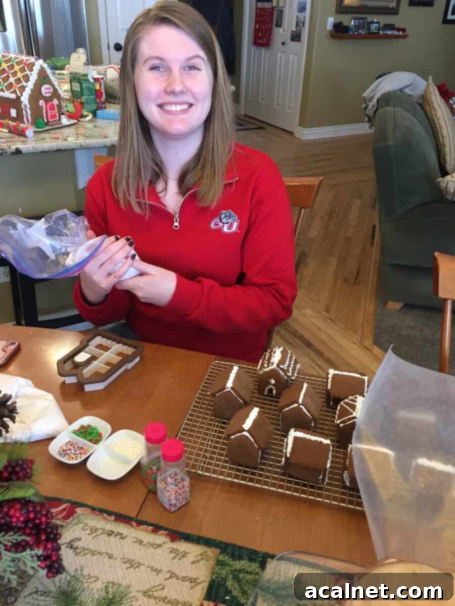 Madeline decorating each tiny gingerbread house.