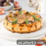 Passion fruit cheesecake on two large white plates, with passion fruits in the background.