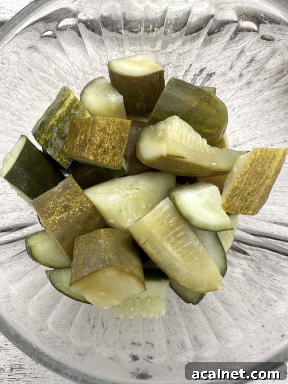 Diced pickles in a bowl, ready for the food processor.