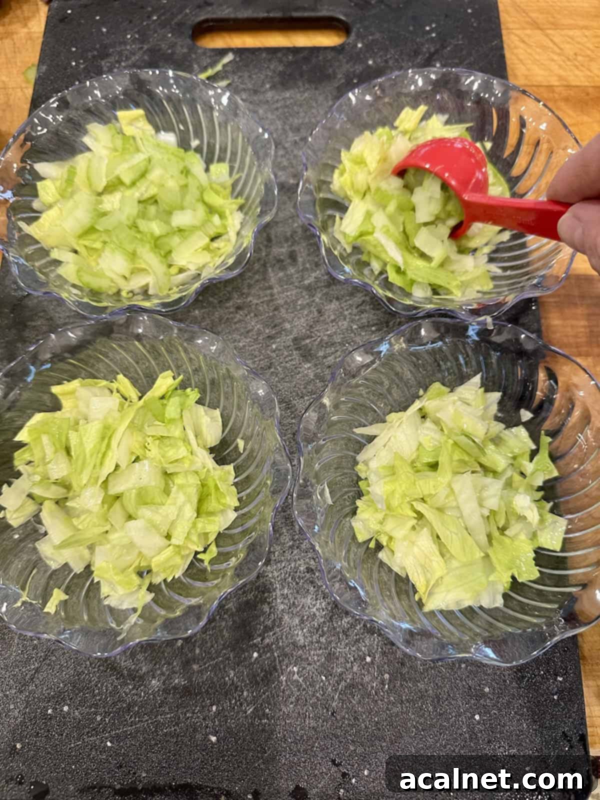 Shrimp Cocktail Shooters 6 Small cups filled with lettuce and chopped celery.