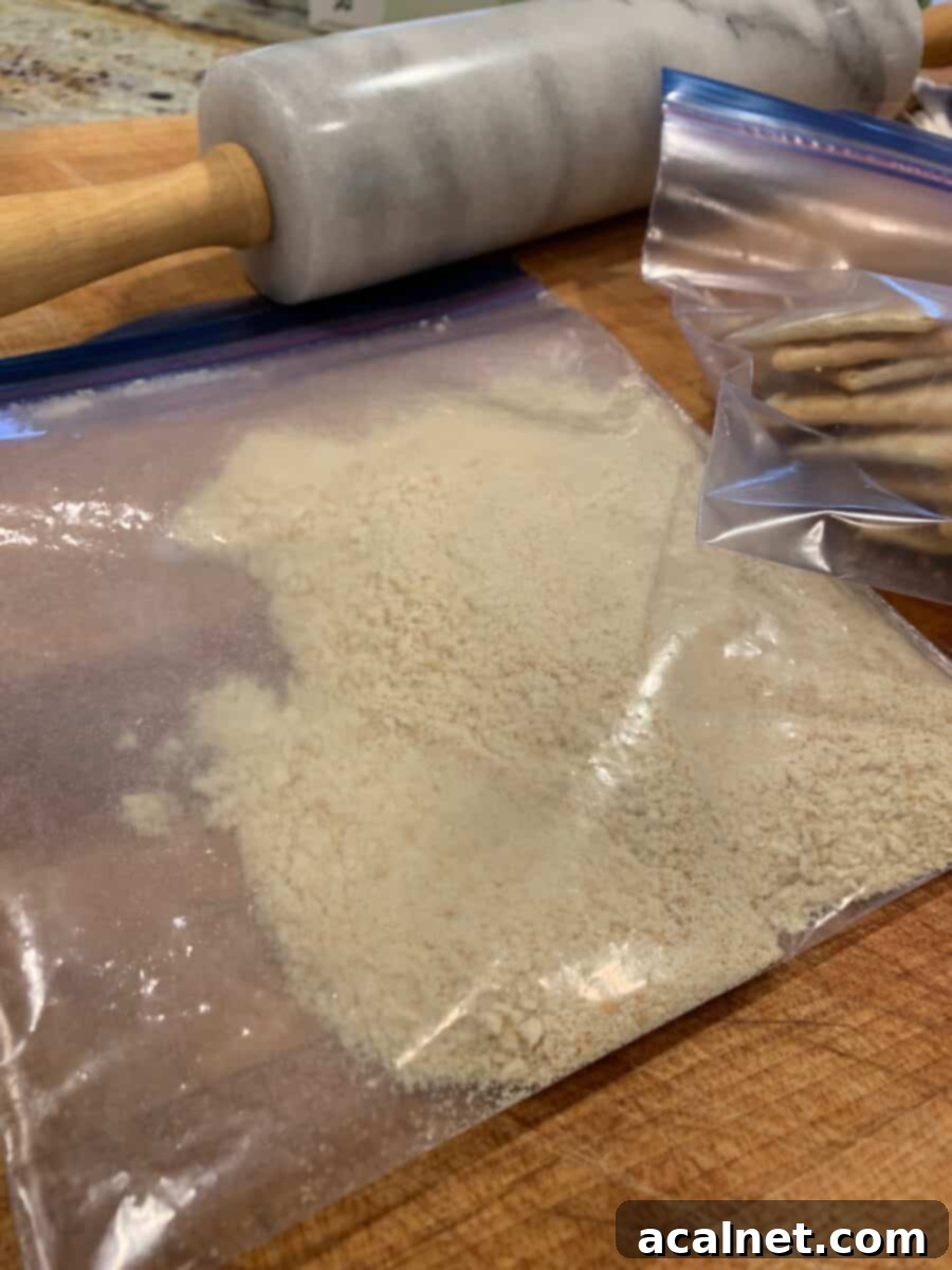 Crushed saltine crackers in a plastic bag, ready to be mixed for the breading.