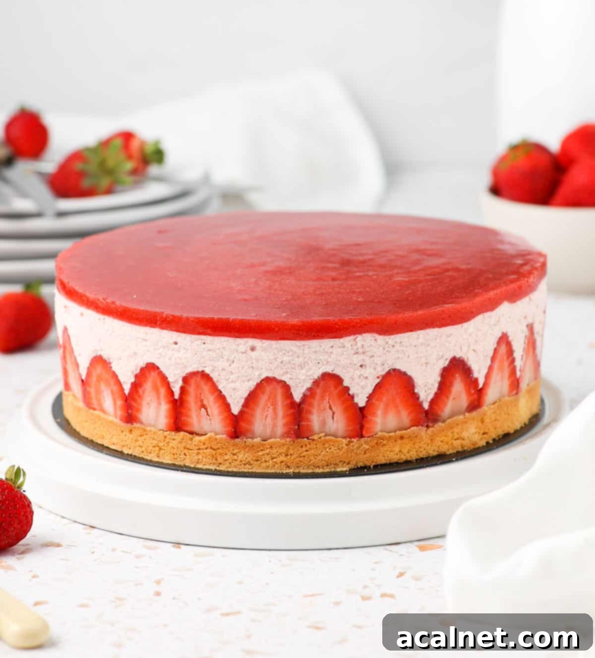 Airy Strawberry Dream Cake 8 Strawberry Cake on a large white plate.